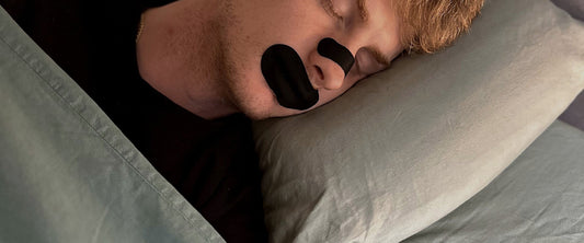 Sleeping peacefully wearing 18pointthree Mouth Tape and a nasal strip