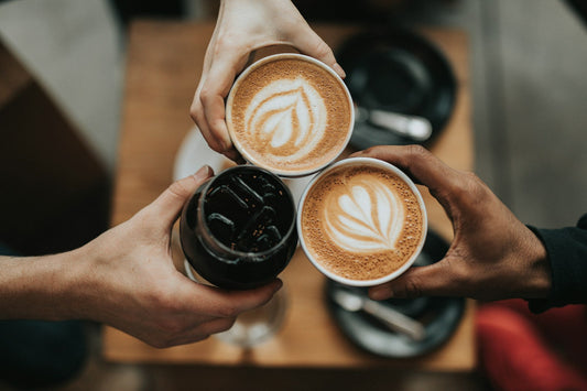 A warm cup of coffee on a dark background, illustrating how afternoon caffeine timing affects deep sleep