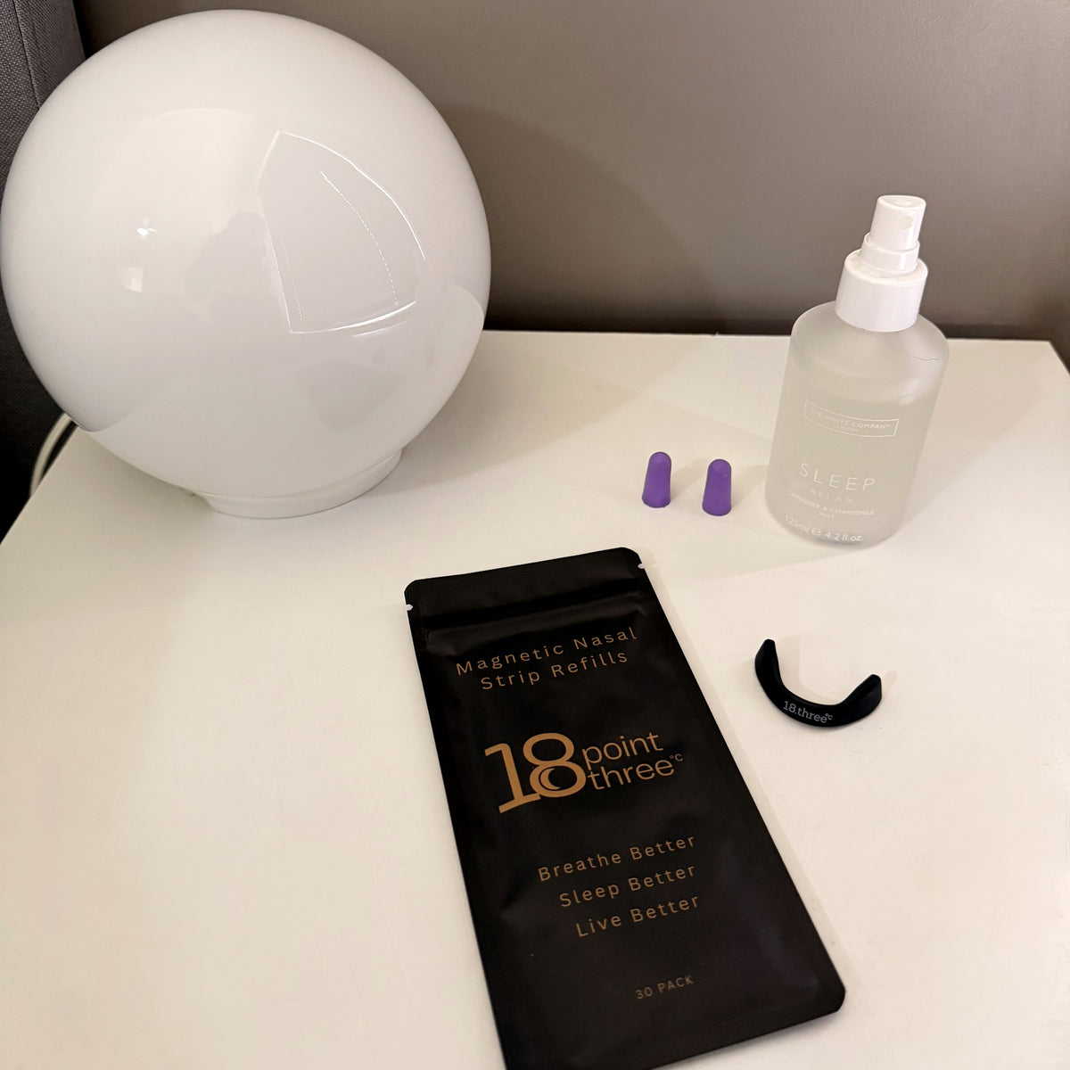 18pointthree Magnetic Nasal Strip Refill Patches on a bedside table