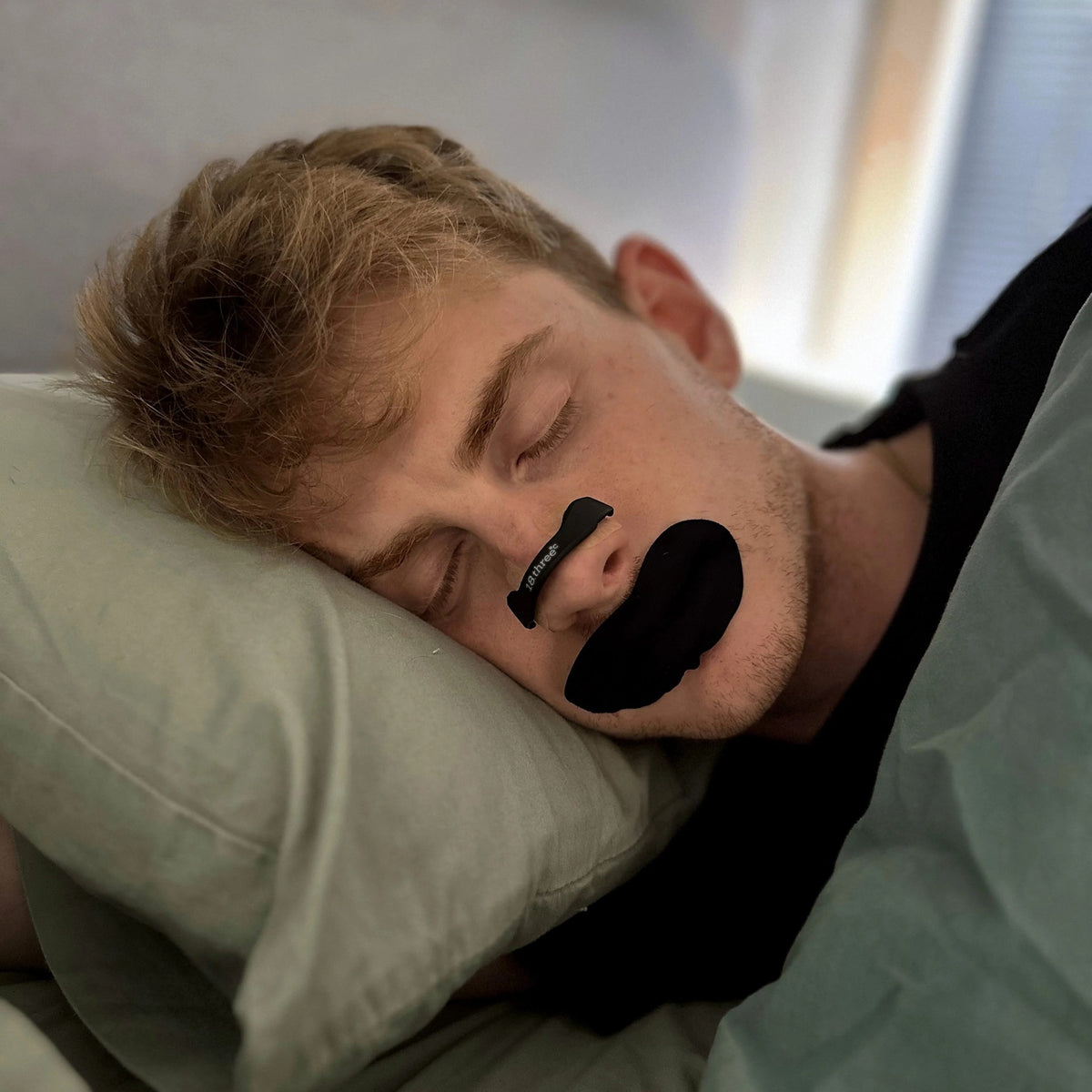 Man asleep in bed at night