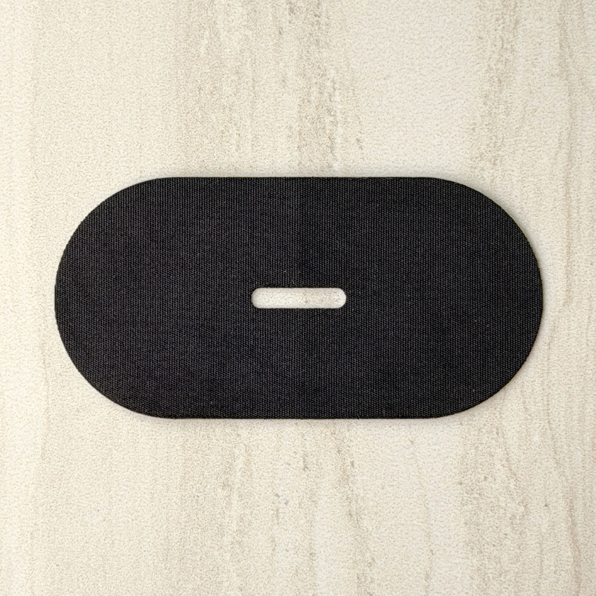 Close-up of 18pointthree mouth tape showing the vent hole through the centre