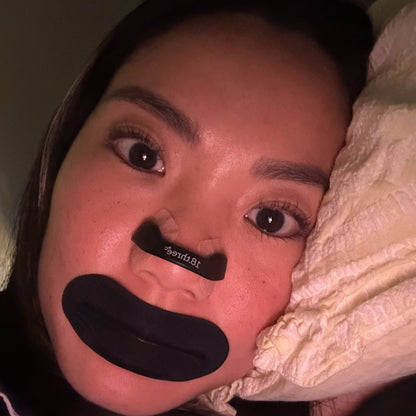 Man wearing an 18pointthree nasal strip and mouth tape before sleep