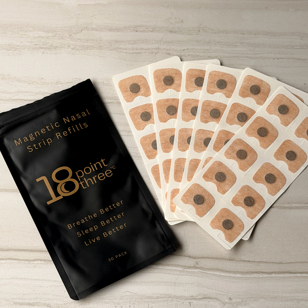 Refill pouch with sheets of magnetic patches fanned out beside it